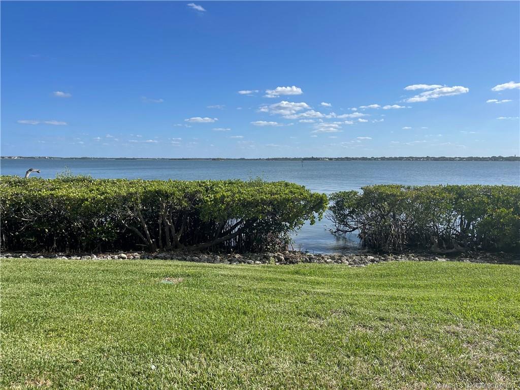 144 Northeast Edgewater Drive, Unit 3102 Stuart, FL 34996 - Photo 21 of 23 a view of a golf course with a lake