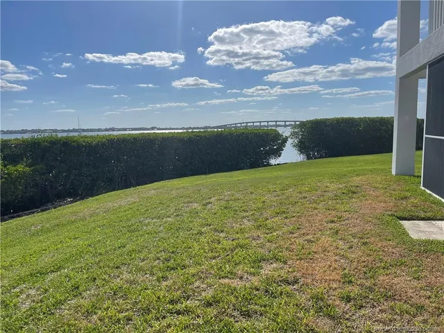a view of a lake with a big yard