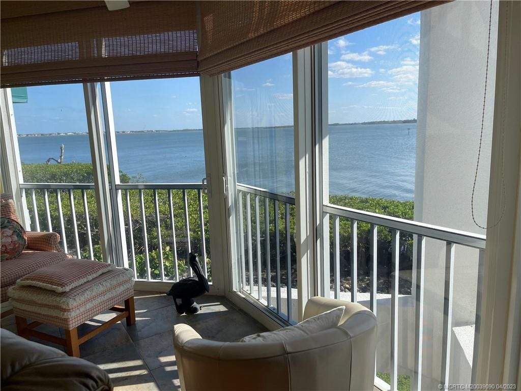 144 Northeast Edgewater Drive, Unit 3102 Stuart, FL 34996 - Photo 3 of 23 a balcony with furniture
