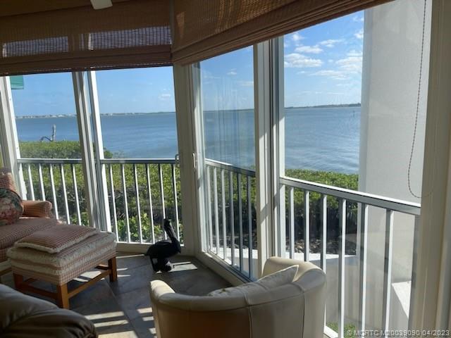 144 Northeast Edgewater Drive, Unit 3102 Stuart, FL 34996 - Photo 4 of 23 a balcony with furniture
