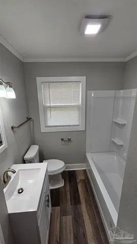 a bathroom with a sink toilet and tub