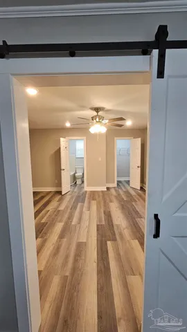 a view of a living room with a wooden floor