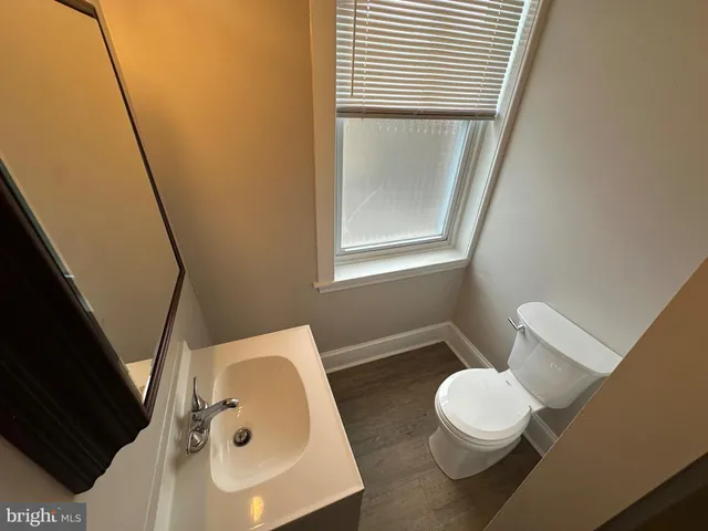a bathroom with a toilet and a sink