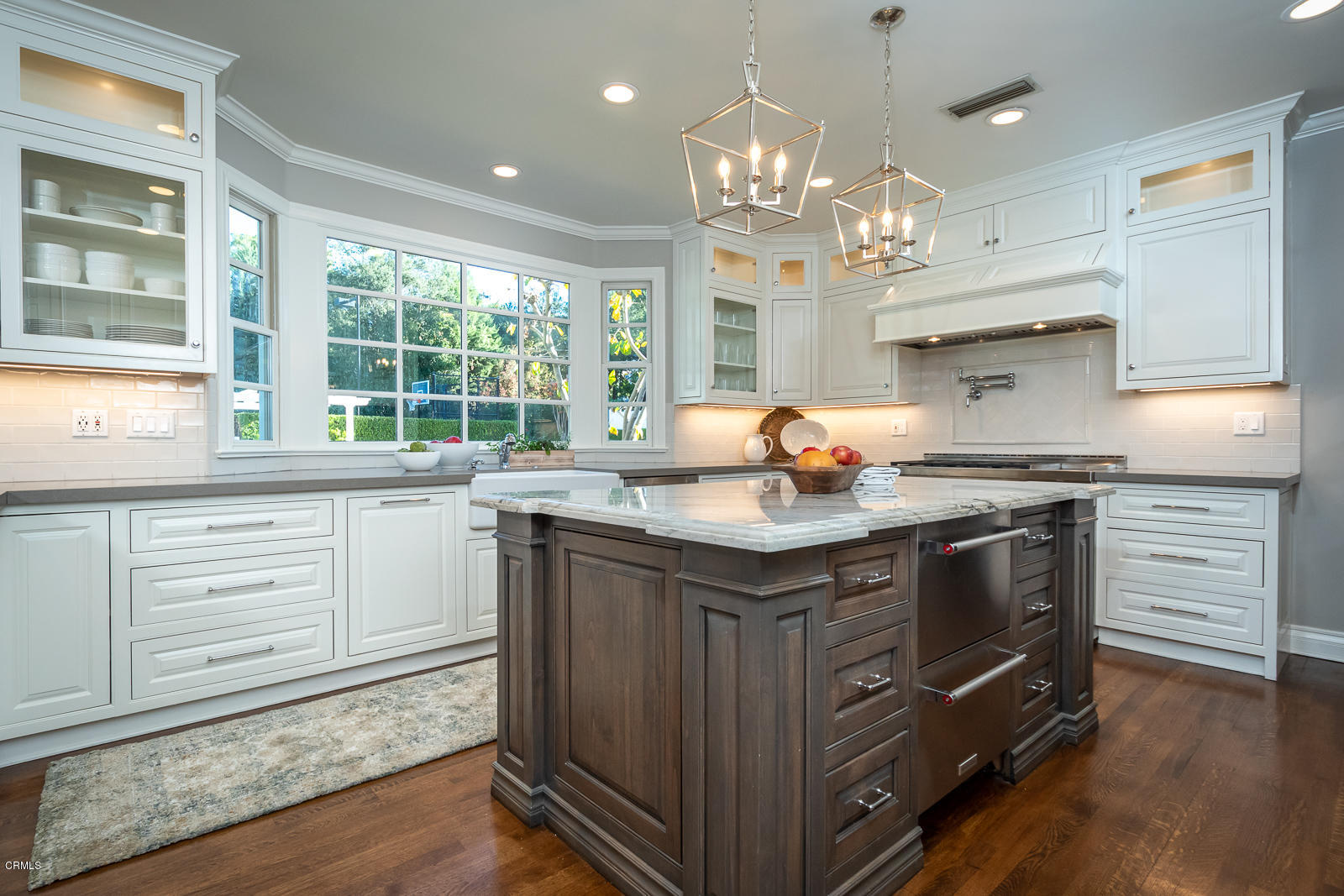 551 Georgian Road La Canada Flintridge, CA 91011 - Photo 13 of 56 a kitchen with stainless steel appliances granite countertop a lot of counter space and wooden floors
