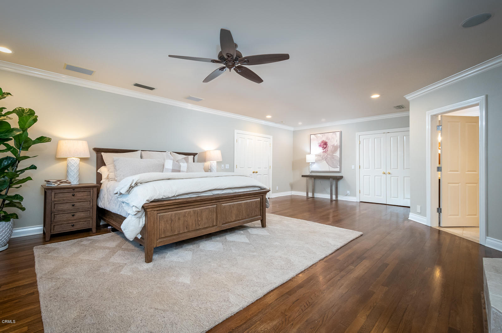 551 Georgian Road La Canada Flintridge, CA 91011 - Photo 27 of 56 a spacious bedroom with a bed and a chandelier
