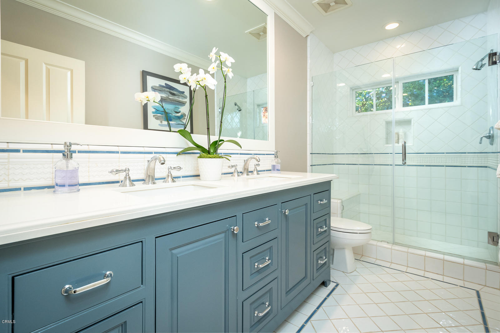 551 Georgian Road La Canada Flintridge, CA 91011 - Photo 39 of 56 a bathroom with a double vanity sink a toilet and a mirror