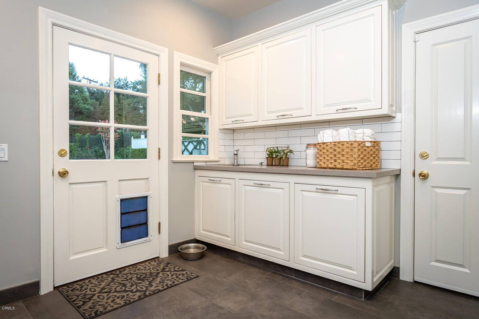 551 Georgian Road La Canada Flintridge, CA 91011 - Photo 42 of 56 a kitchen with a sink and cabinets