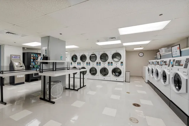 a kitchen with stainless steel appliances a white cabinet and a sink