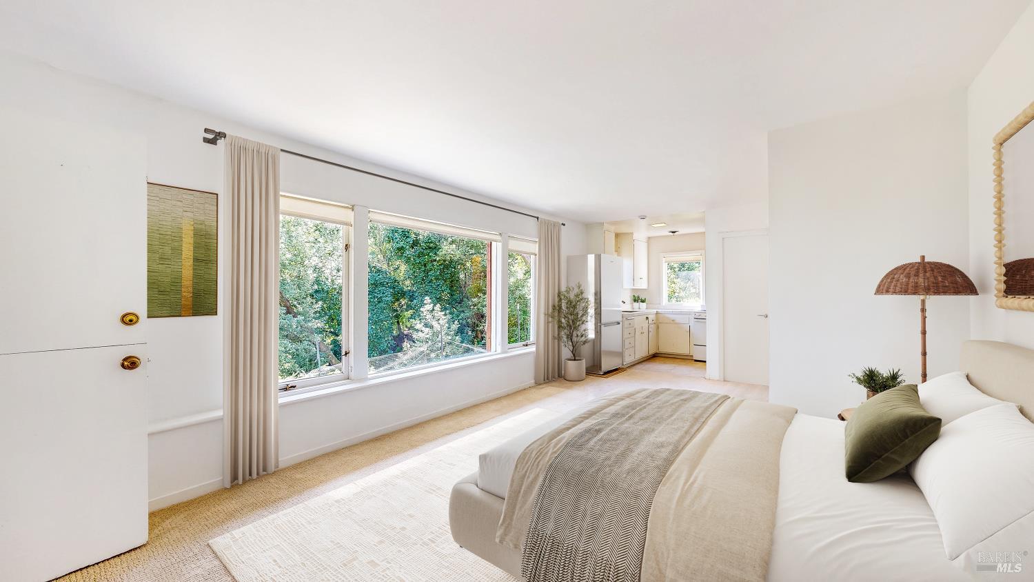 295 Scenic Road Fairfax, CA 94930 - Photo 2 of 17 a bedroom with a large bed and a large window