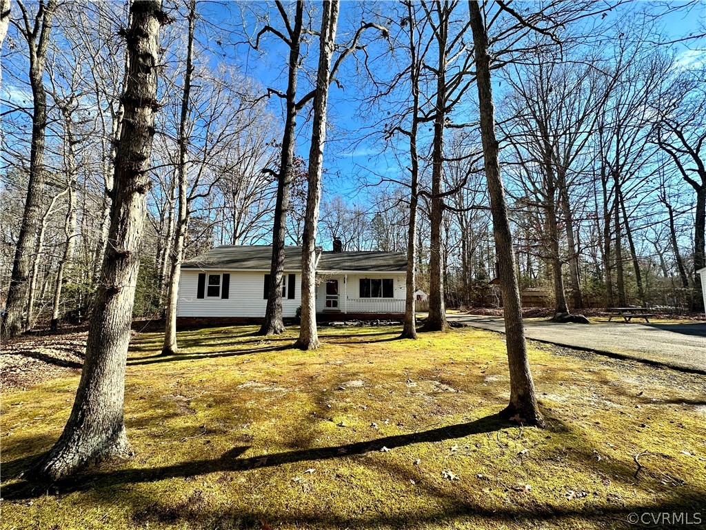 10421 Ambridge Road Chesterfield, VA 23832 - Photo 3 of 25 a view of a swimming pool with an outdoor seating