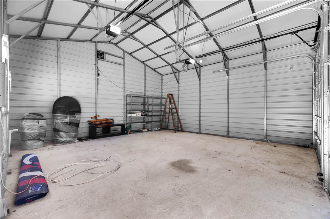 159 Cherokee Trail Easley, SC 29640 - Photo 31 of 38 A spacious, clean garage with tall ceilings, perfect for storage or a workshop.