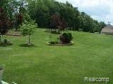 245 Foxfire Drive Howell, MI 48843 - Photo 4 of 6 foxfire yard2.jpg