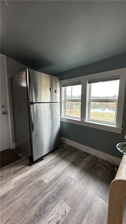 7040 Alan Thomas Road Dawsonville, GA 30534 - Photo 6 of 7 a view of an empty room with wooden floor and a window