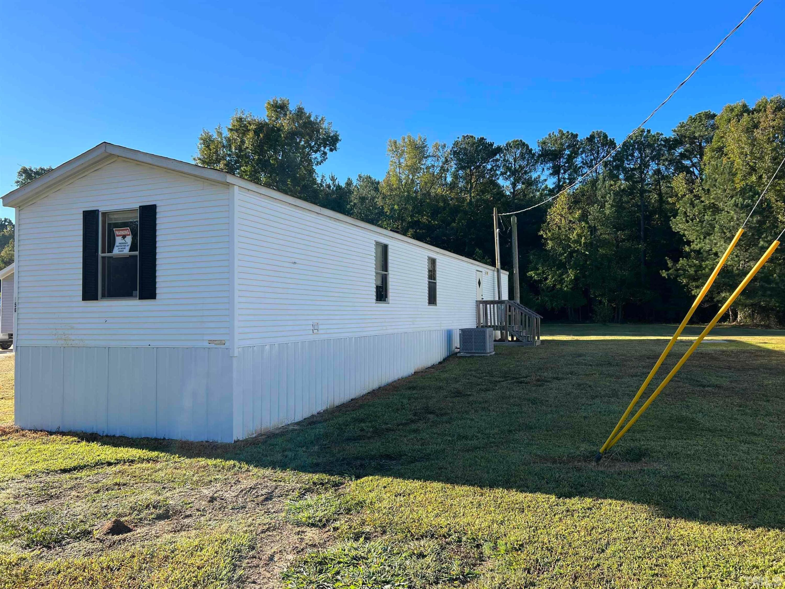 56 Pine Forest Way Louisburg, NC 27549 - Photo 2 of 9 a view of a backyard