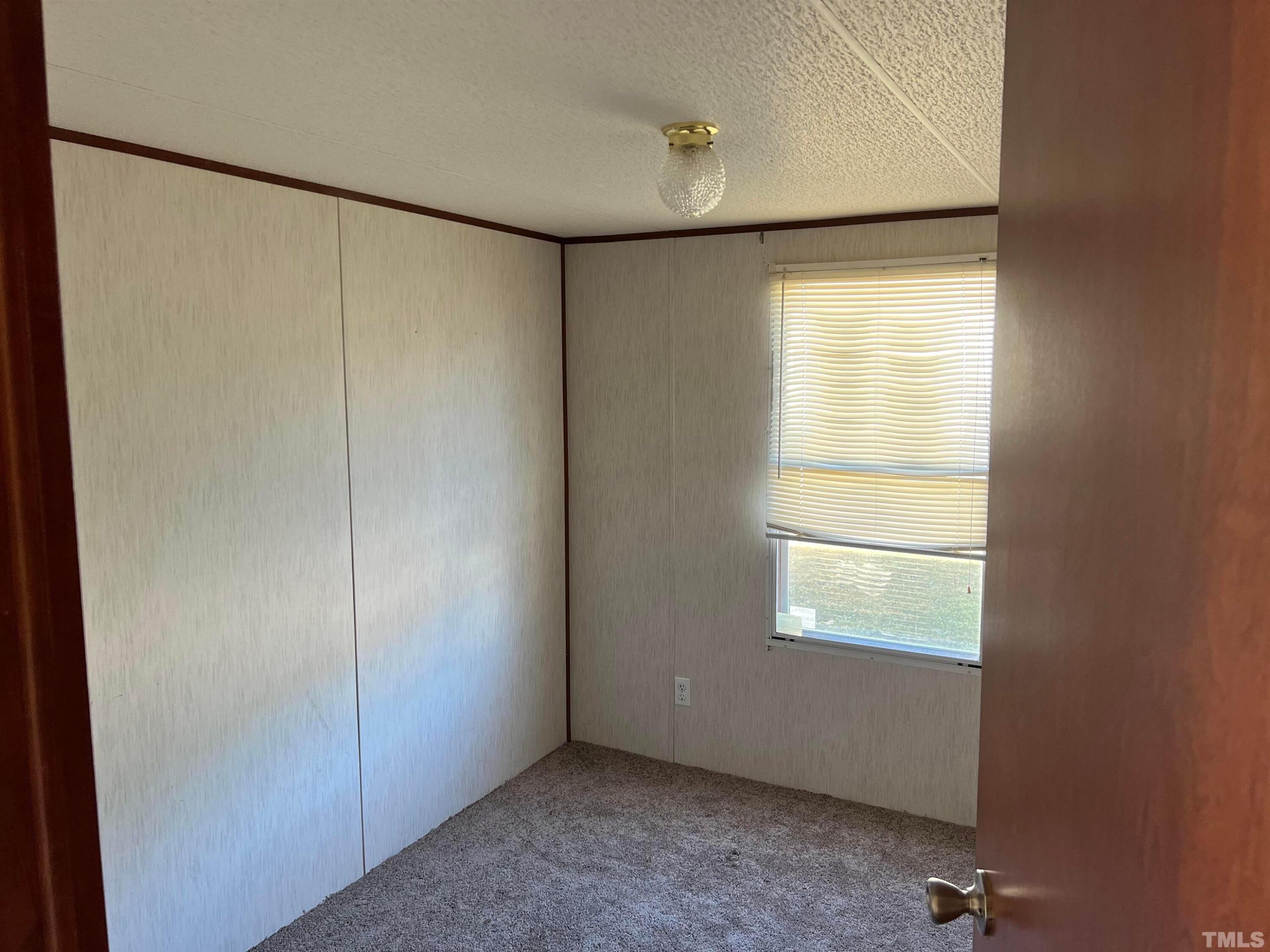 56 Pine Forest Way Louisburg, NC 27549 - Photo 9 of 9 a view of an empty room with a window