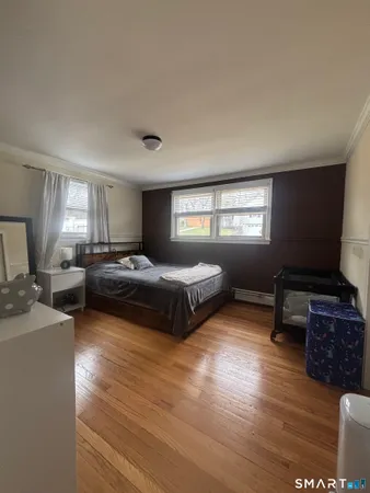 a bedroom with furniture and a window