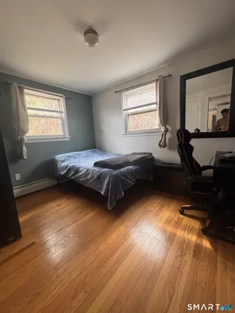 a bedroom with bed and window