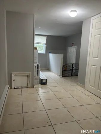 a room with a washing machine and a sink