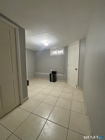 a room with furniture and a flat screen tv