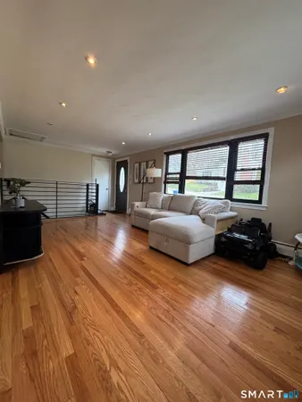 a spacious bedroom with a bed and a couch