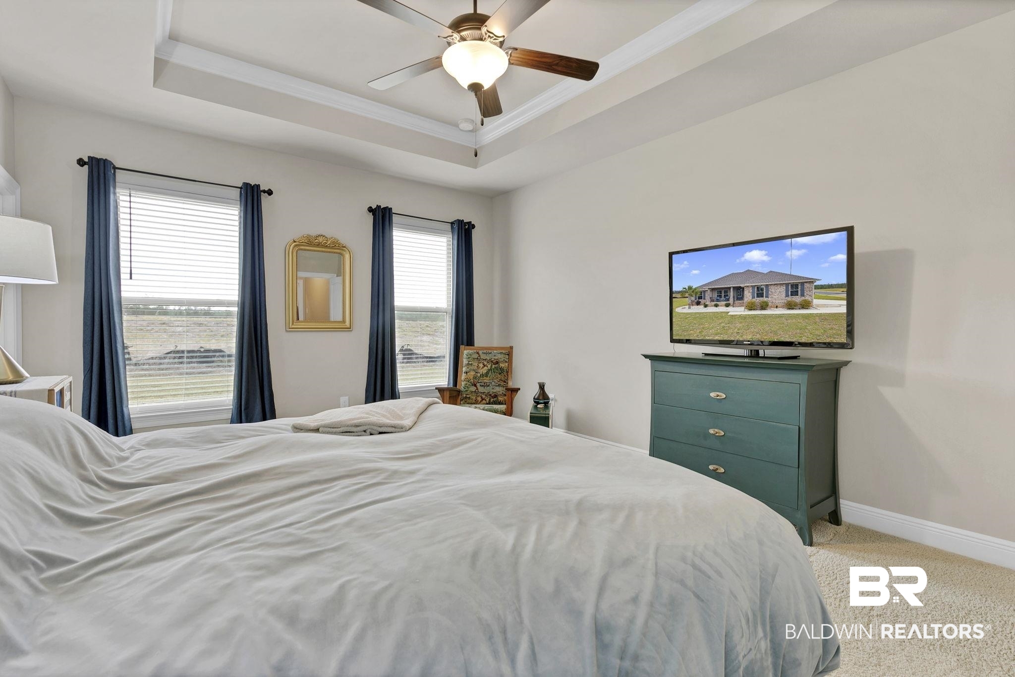 11247 Thistledown Loop Spanish Fort, AL 36527 - Photo 23 of 72 Bedroom with baseboards, a raised ceiling, a ceiling fan, crown molding, and carpet floors
