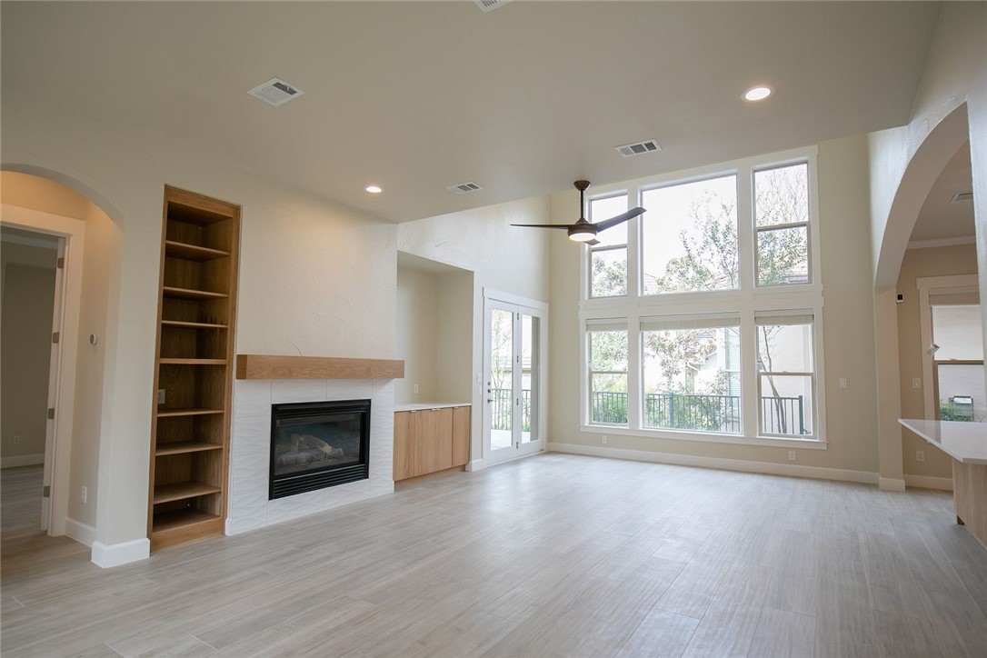 2800 Waymaker Way, Unit 29 Austin, TX 78746 - Photo 7 of 25 an empty room with windows and fireplace