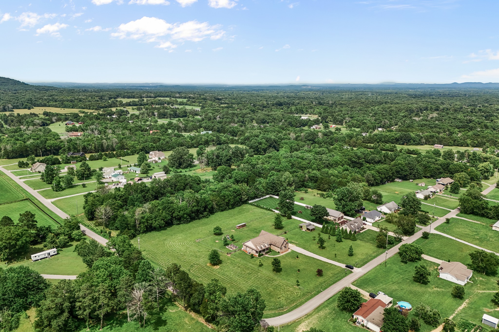 7540 Joe Rowlin Road Christiana, TN 37037 - Photo 40 of 42 an aerial view of residential houses with outdoor space and trees