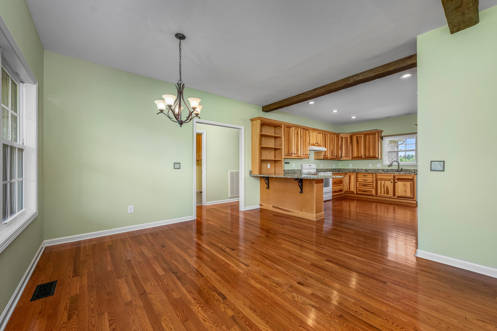 7540 Joe Rowlin Road Christiana, TN 37037 - Photo 8 of 42 a view of a room with wooden floor and a kitchen