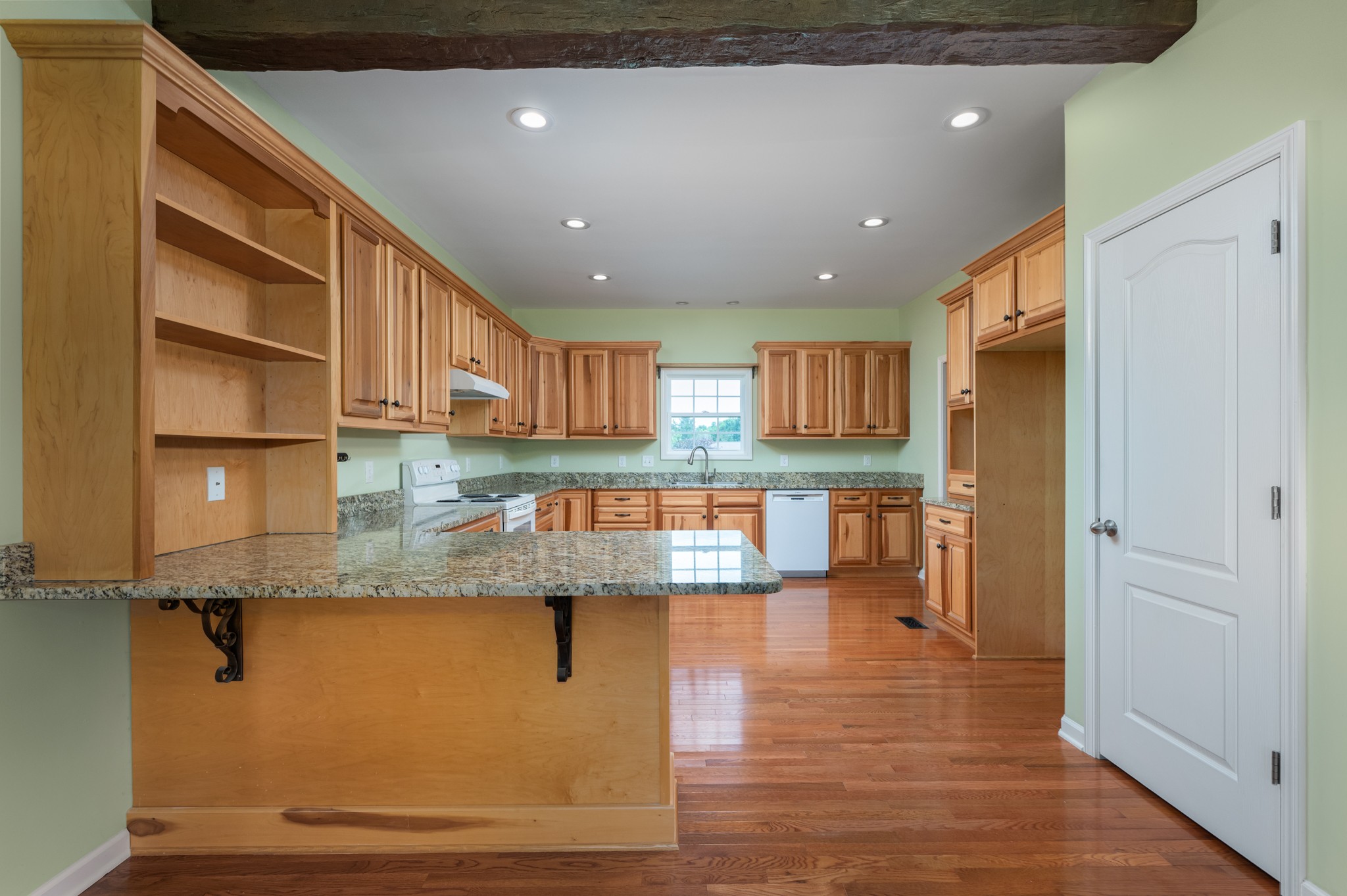 7540 Joe Rowlin Road Christiana, TN 37037 - Photo 9 of 42 a view of a kitchen with stainless steel appliances granite countertop a stove and a refrigerator