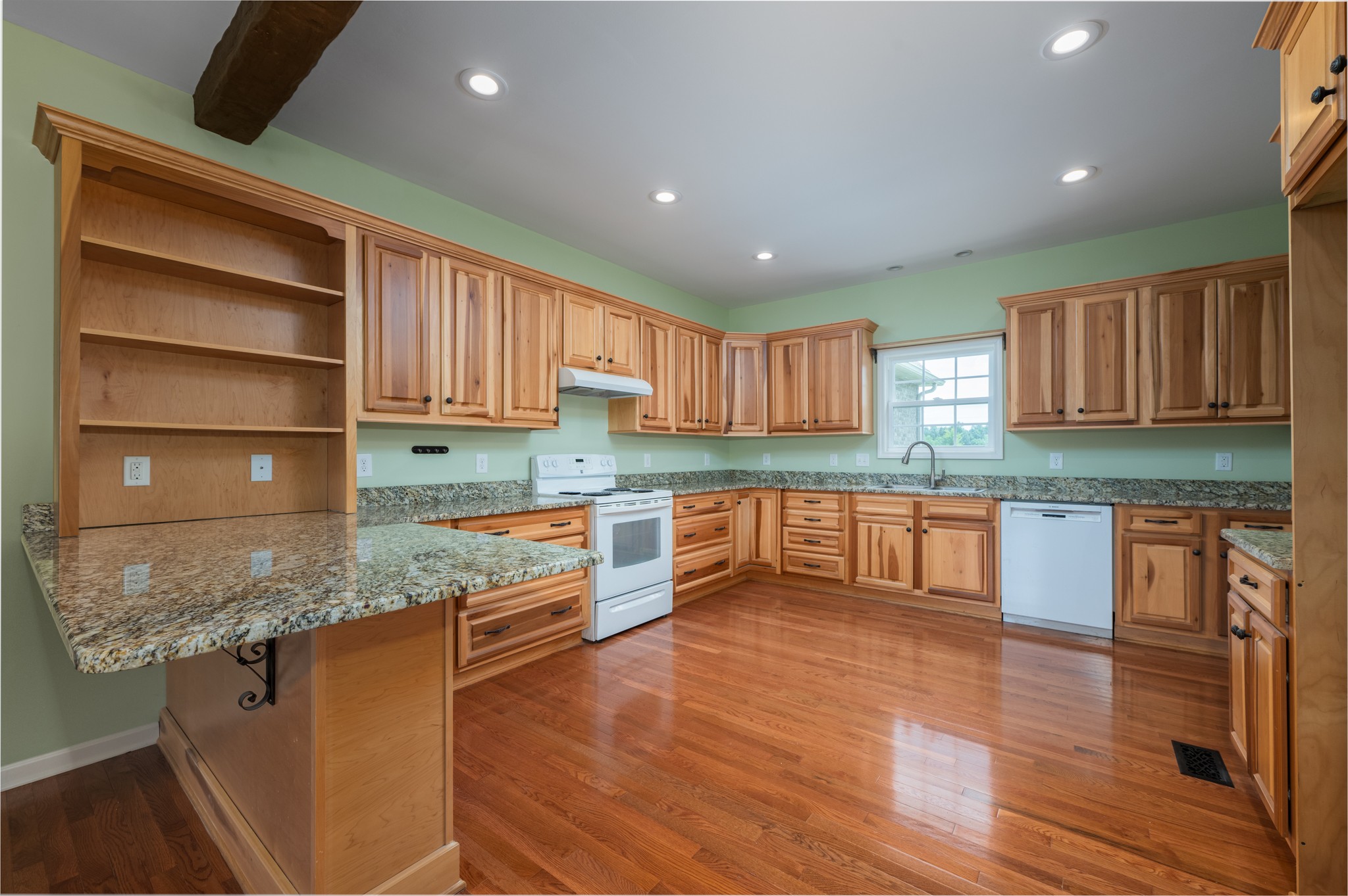 7540 Joe Rowlin Road Christiana, TN 37037 - Photo 10 of 42 a kitchen with stainless steel appliances granite countertop wooden cabinets and a granite counter tops