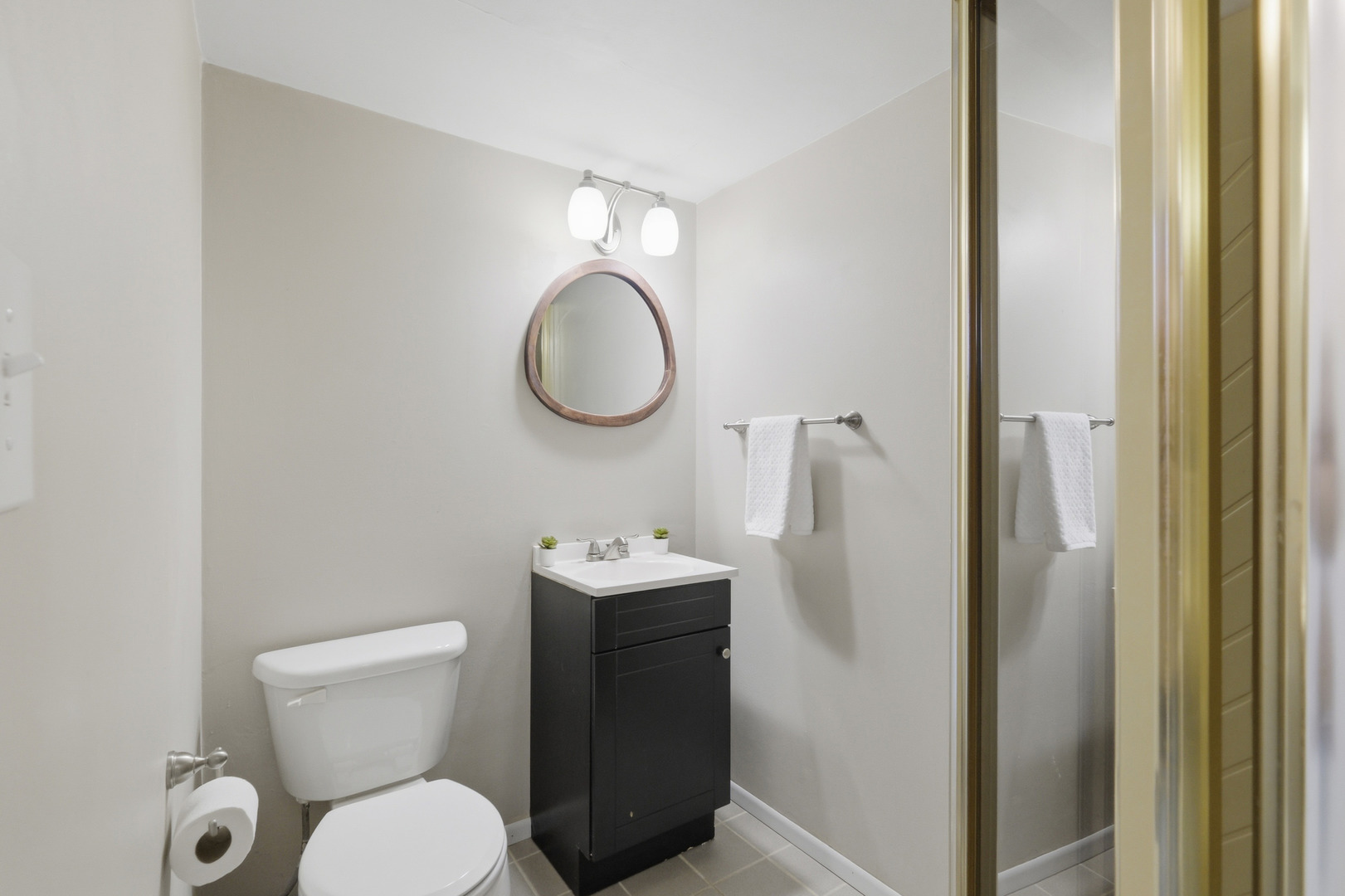 3208 Wren Lane Rolling Meadows, IL 60008 - Photo 16 of 30 a bathroom with a toilet a sink and mirror