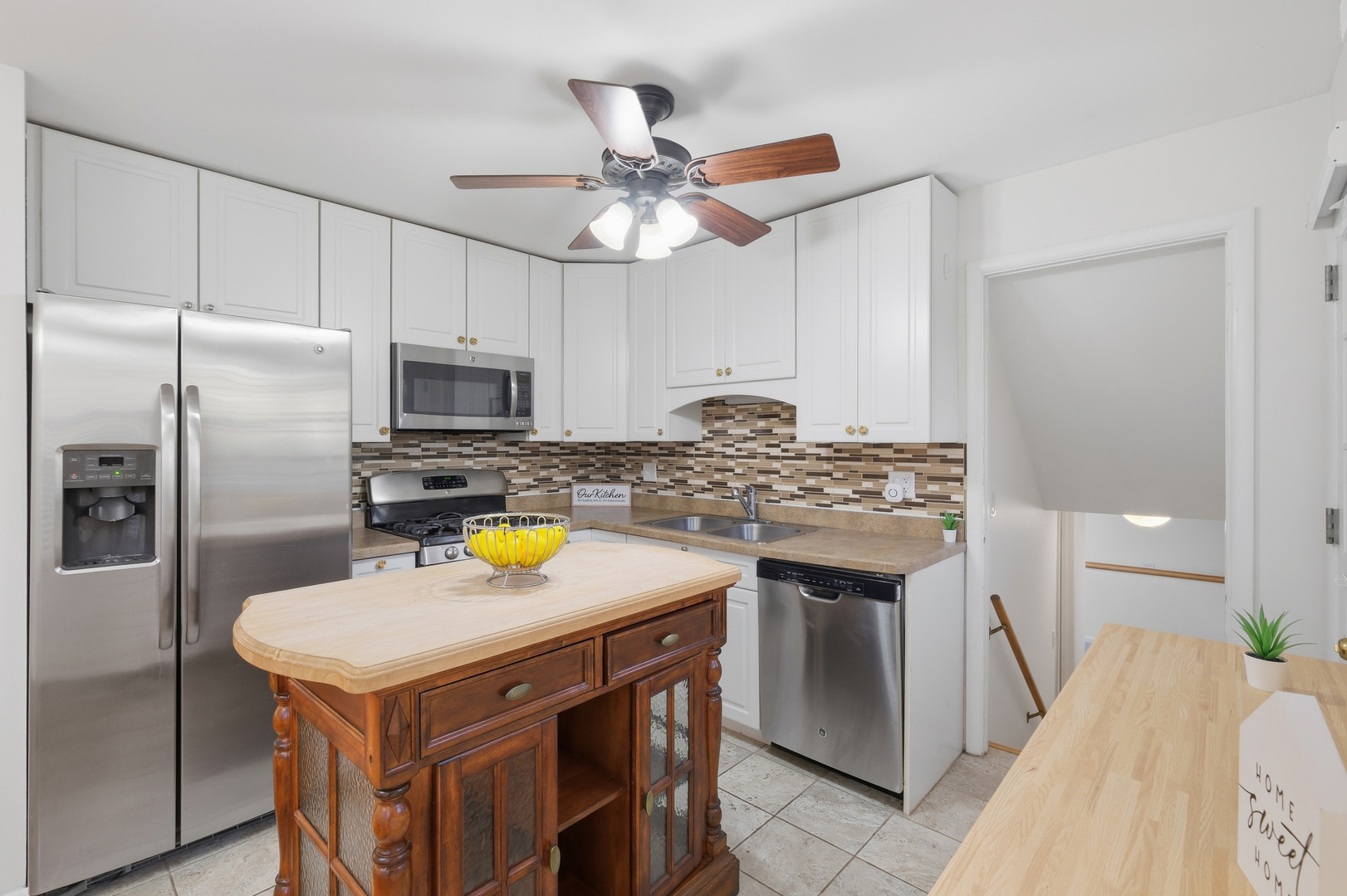 3208 Wren Lane Rolling Meadows, IL 60008 - Photo 7 of 30 a kitchen with stainless steel appliances a stove a sink and a refrigerator