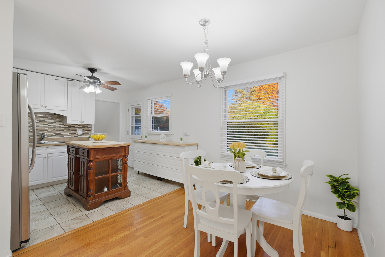 3208 Wren Lane Rolling Meadows, IL 60008 - Photo 9 of 30 a view of a dining room with furniture window and wooden floor