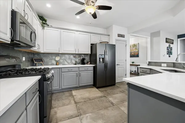 a kitchen with a refrigerator a sink and dishwasher