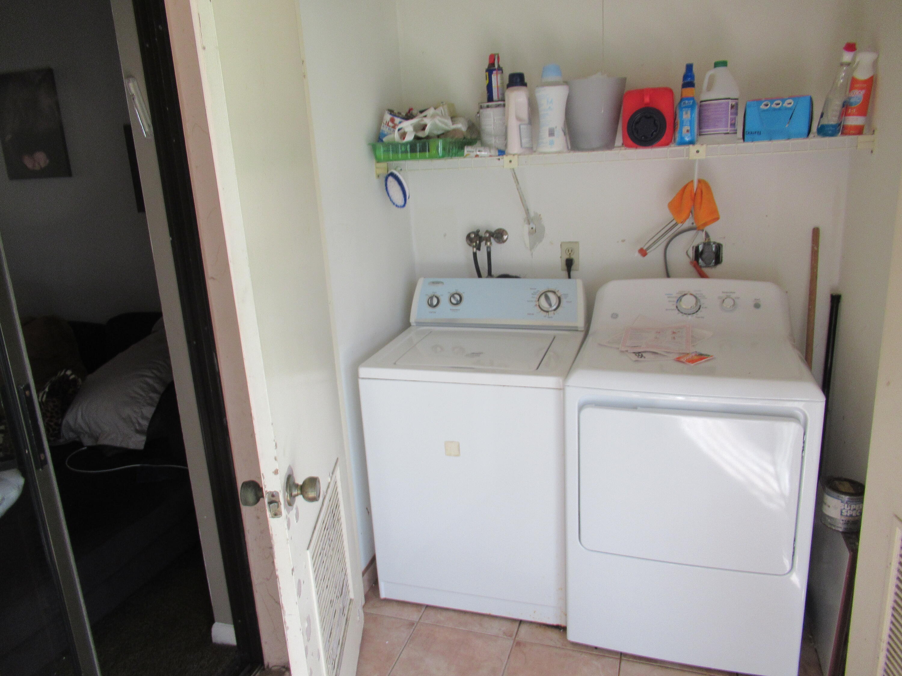 22016 Palms Way, Unit 204 Boca Raton, FL 33433 - Photo 18 of 23 a utility room with dryer and washer