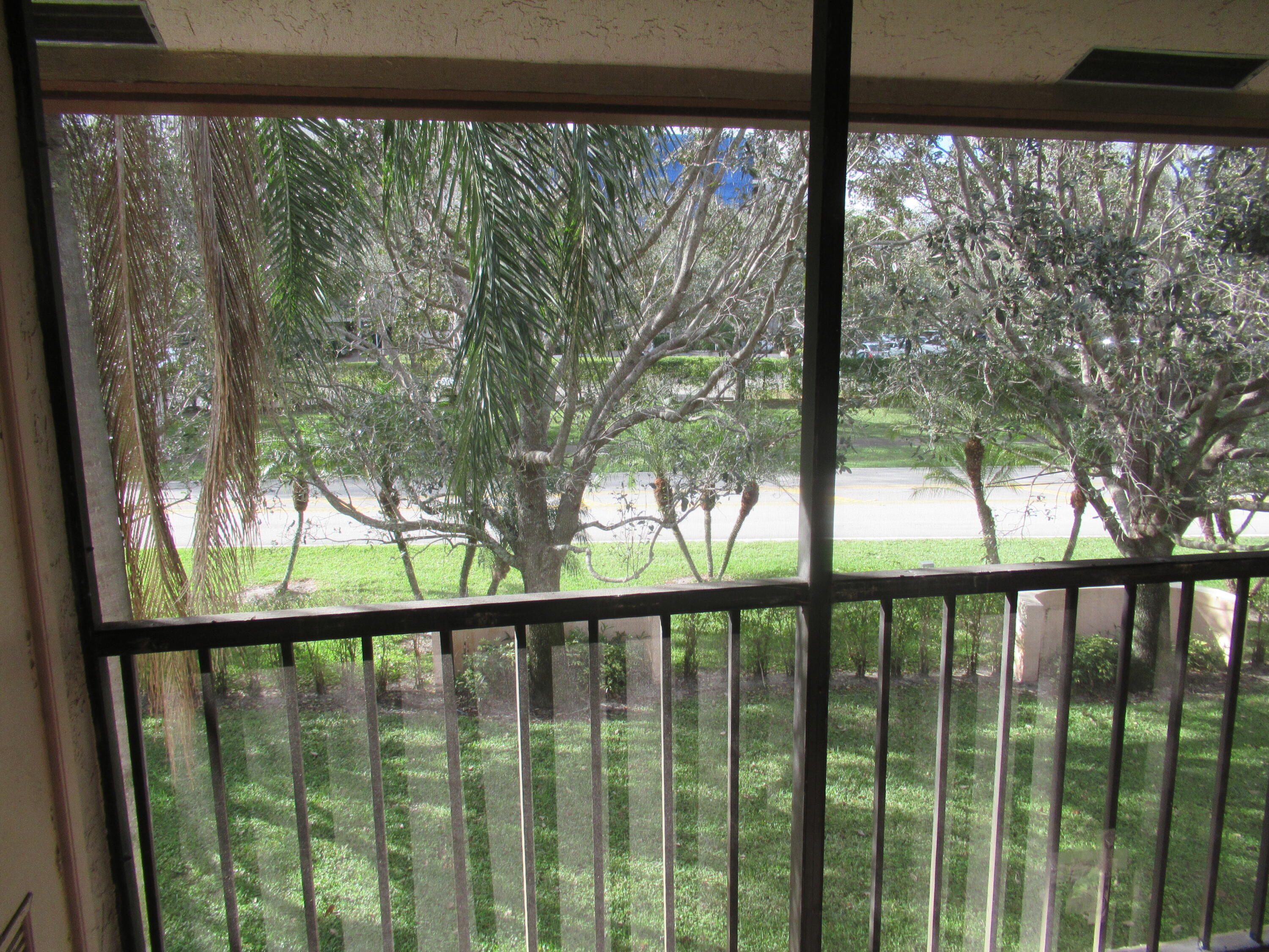 22016 Palms Way, Unit 204 Boca Raton, FL 33433 - Photo 19 of 23 a view of a street from a balcony