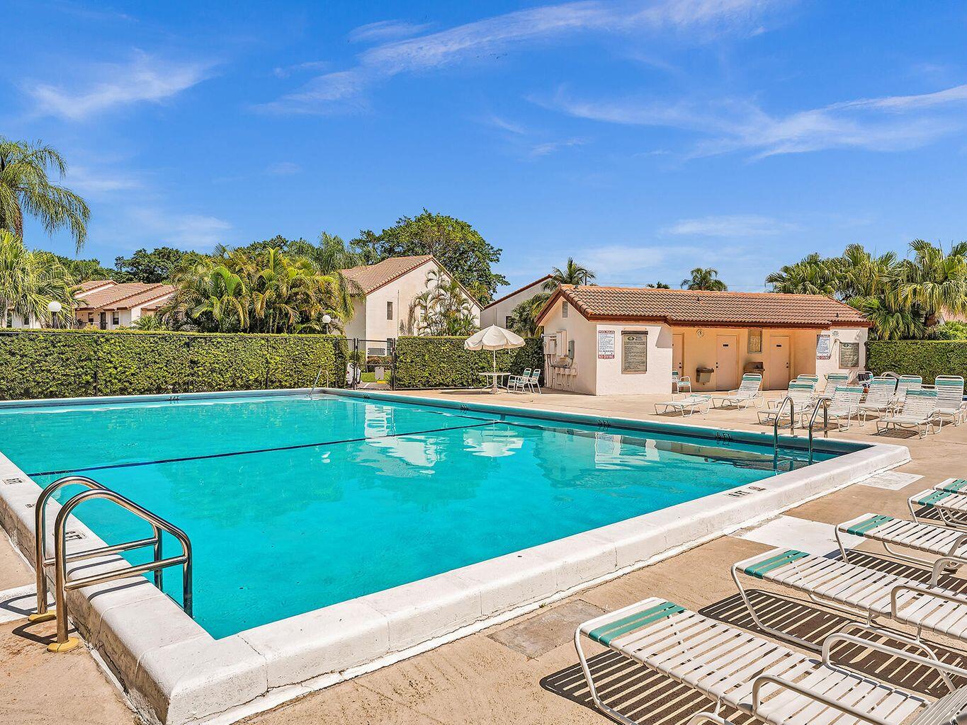 22016 Palms Way, Unit 204 Boca Raton, FL 33433 - Photo 20 of 23 a view of a balcony with two chairs and a table