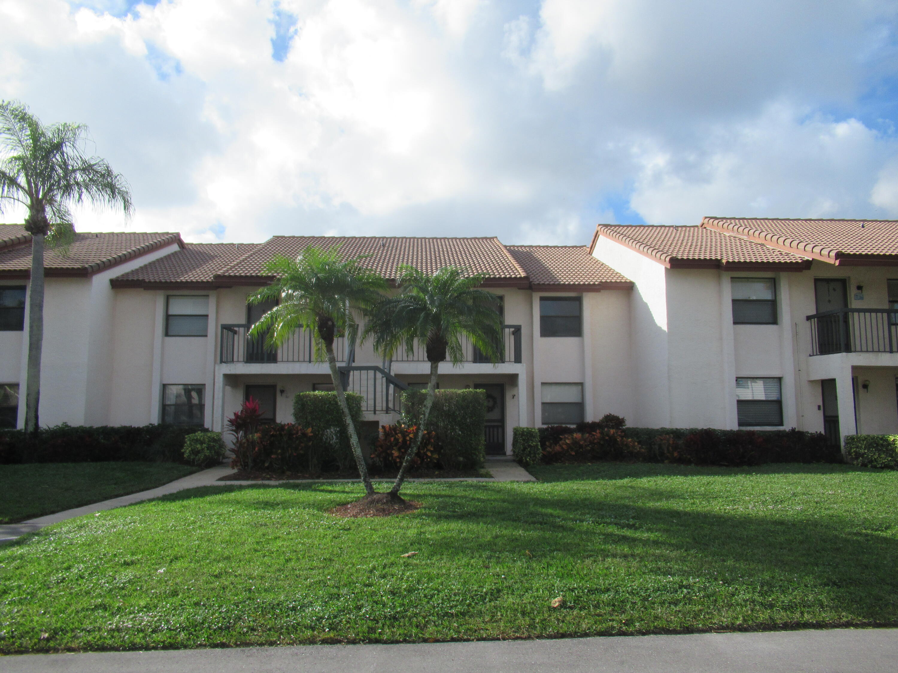 22016 Palms Way, Unit 204 Boca Raton, FL 33433 - Photo 2 of 23 a view of a house with a backyard