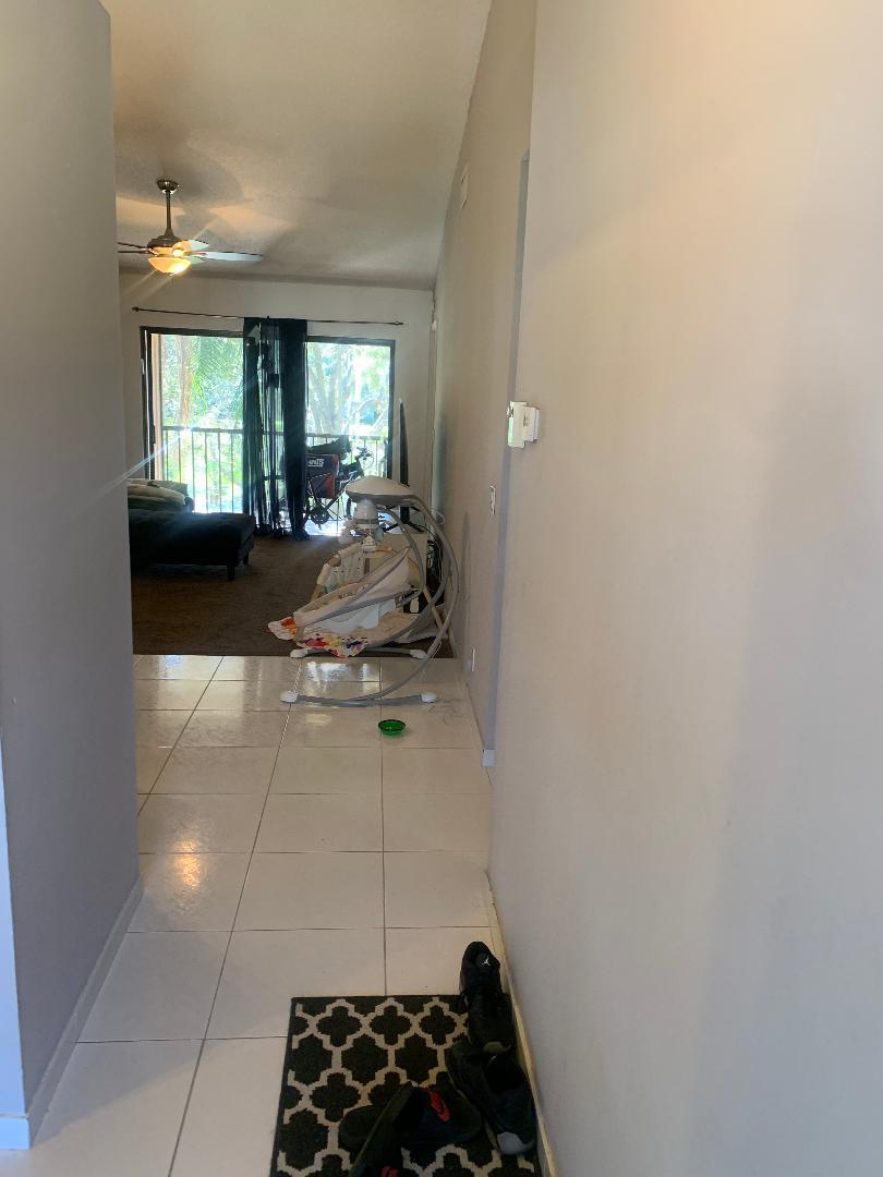 22016 Palms Way, Unit 204 Boca Raton, FL 33433 - Photo 3 of 23 a living room with furniture and a window