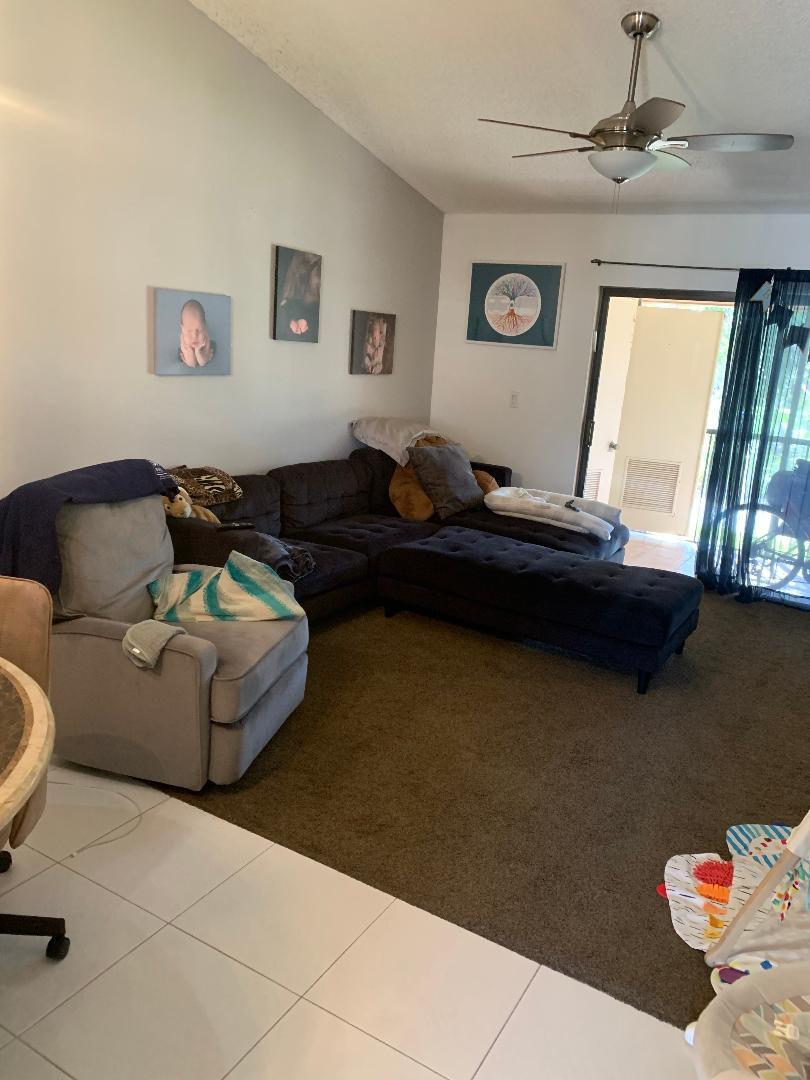 22016 Palms Way, Unit 204 Boca Raton, FL 33433 - Photo 7 of 23 a living room with furniture and a window