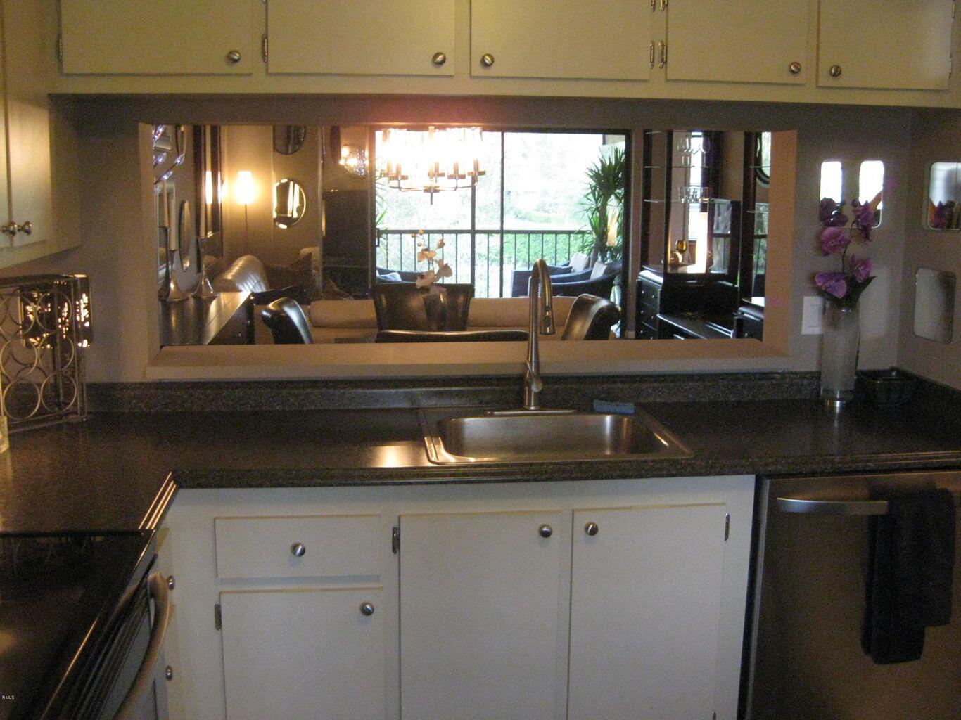 22016 Palms Way, Unit 204 Boca Raton, FL 33433 - Photo 9 of 23 a kitchen with sink and window