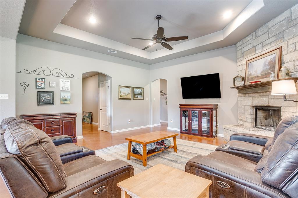 1028 Hope Court Boyd, TX 76023 - Photo 11 of 40 a living room with furniture and a flat screen tv