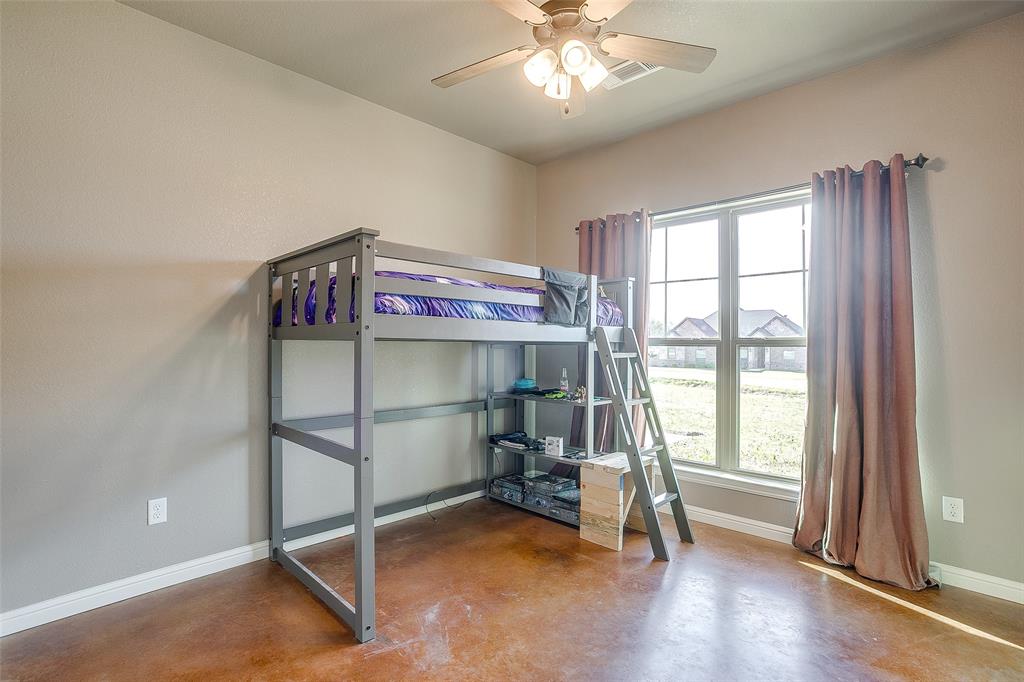 1028 Hope Court Boyd, TX 76023 - Photo 29 of 40 a view of a room with gym equipment and floors
