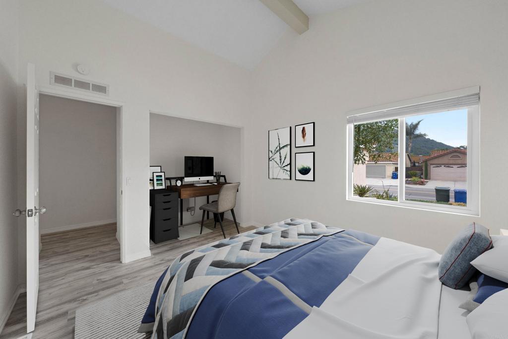 4938 Dulin Road Fallbrook, CA 92028 - Photo 11 of 15 a bedroom with a bed and a flat screen tv