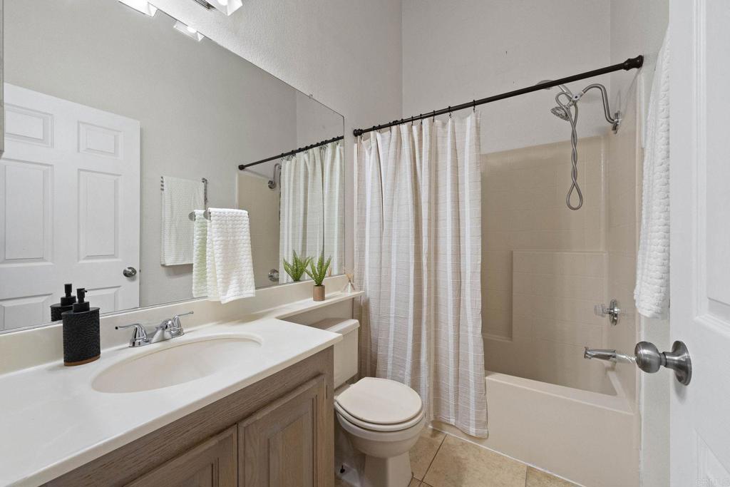4938 Dulin Road Fallbrook, CA 92028 - Photo 12 of 15 a bathroom with a sink toilet and shower