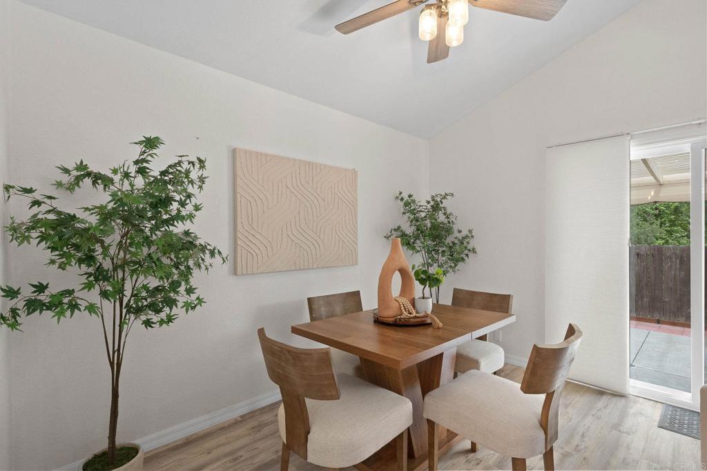 4938 Dulin Road Fallbrook, CA 92028 - Photo 5 of 15 a view of a dining room with furniture and wooden floor