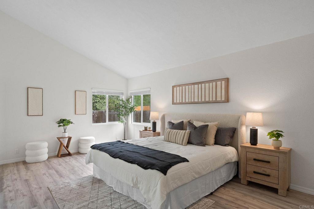 4938 Dulin Road Fallbrook, CA 92028 - Photo 7 of 15 a bedroom with a bed and a large window