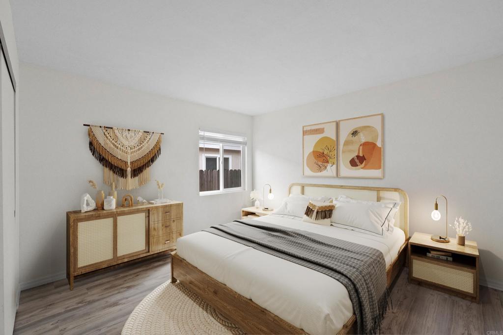 4938 Dulin Road Fallbrook, CA 92028 - Photo 10 of 15 a bedroom with a bed and a chandelier