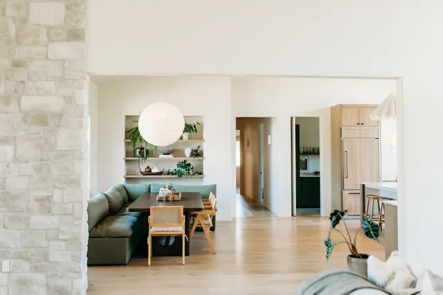 a living room with furniture and a potted plant