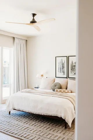 a bathroom with a sink vanity mirror and toilet